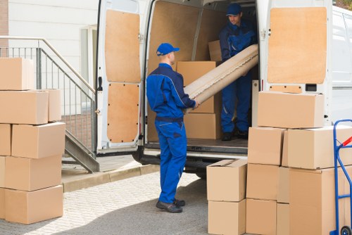 Office relocation planning in Brompton with moving boxes and furniture