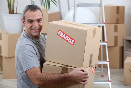 Local team removing unwanted furniture from a Brompton flat with careful handling