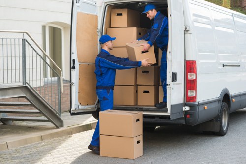 Packed office furniture and boxes ready for a commercial move in Brompton