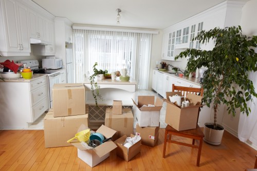 Preparation for a Brompton flat move with labelled boxes and protective wrapping