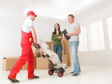 Local removals team preparing a Brompton home move with boxes and furniture
