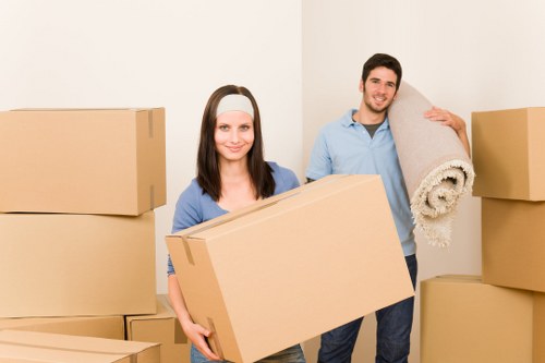Moving crew unloading furniture and boxes at a Brompton property
