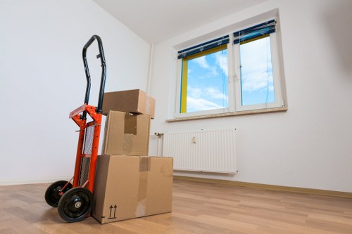 Packed boxes and furniture prepared for flat removals in Brompton