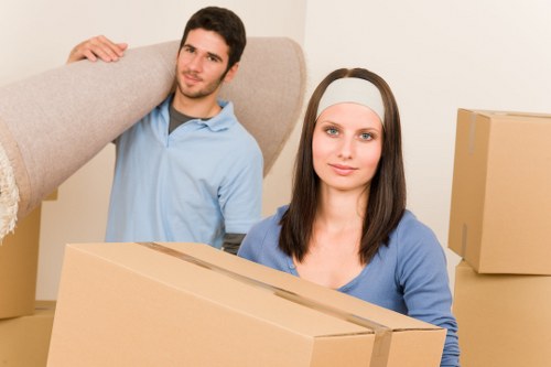 Local movers handling furniture in a Brompton street