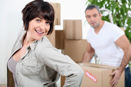 Careful wrapping of fragile household items during a Brompton packing service