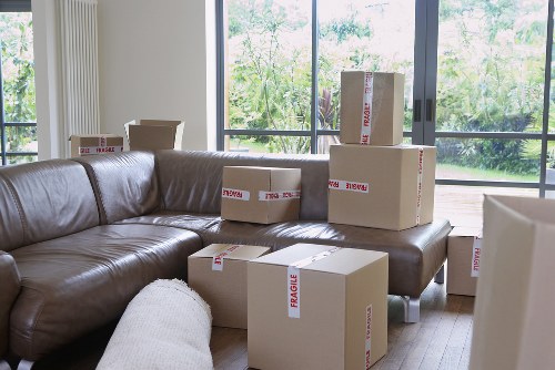 Packed moving boxes and protective wrapping prepared for a Brompton home move